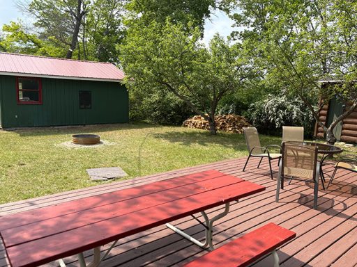 Back Yard with Picnic Table and Firepit Image