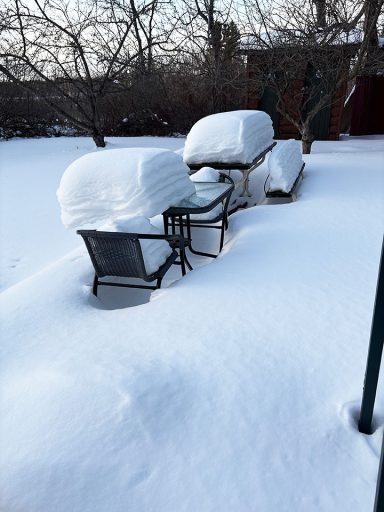 Winter Snowfall Lying on Patio Furniture Image